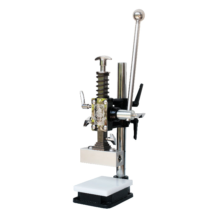 Industrial manual leather press machine with steel lever, adjustable knobs, and white stamping platform for embossing and flattening leather crafts