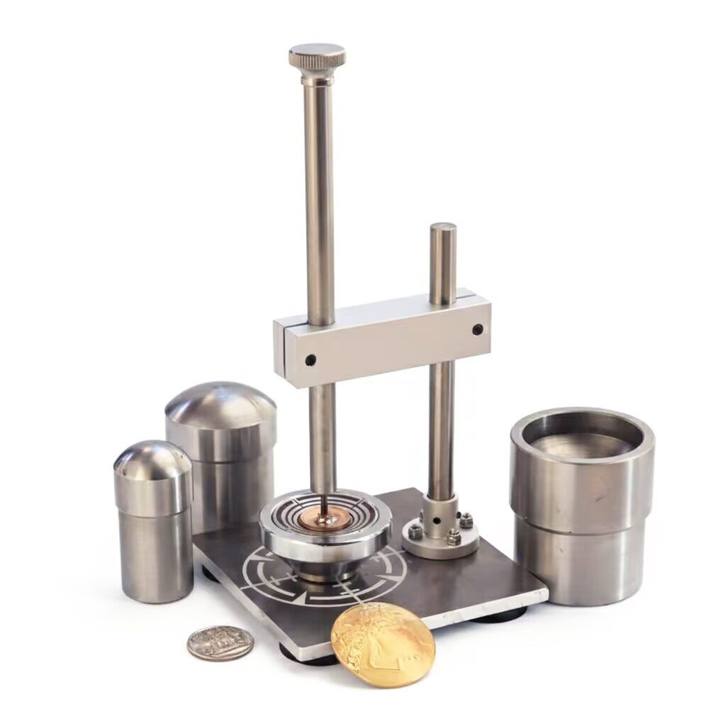 Metallic coin press tool with coins on a white background