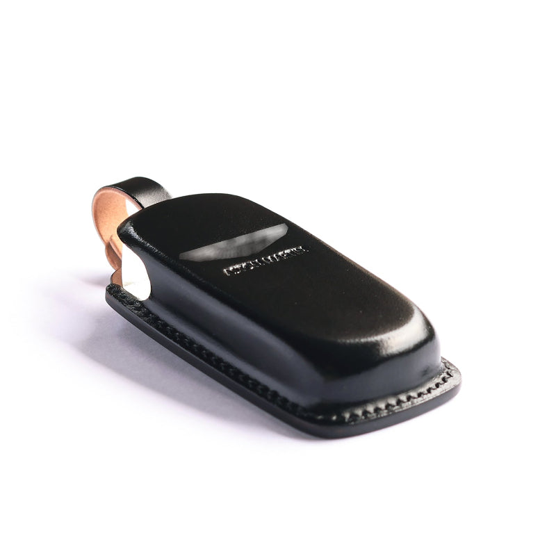Custom fitted leather key cover installed on an Aston Martin Rapide key fob