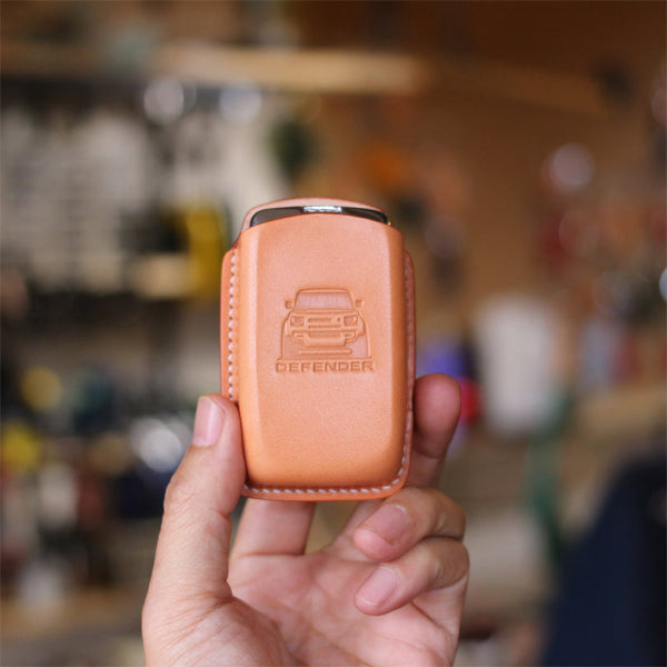 Leather key cover shields Land Rover Defender key from scratches
