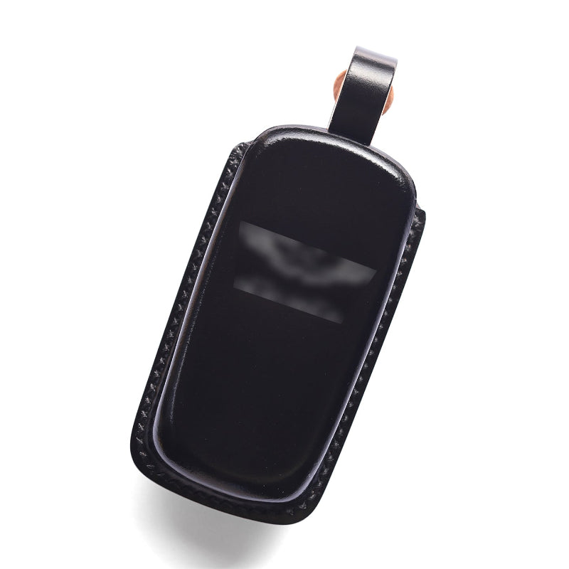 Detail of the hand-stitched leather on the Aston Martin key fob case