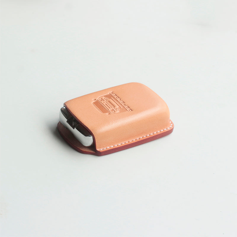 Custom leather key cover snugly fitted on Land Rover Defender key fob