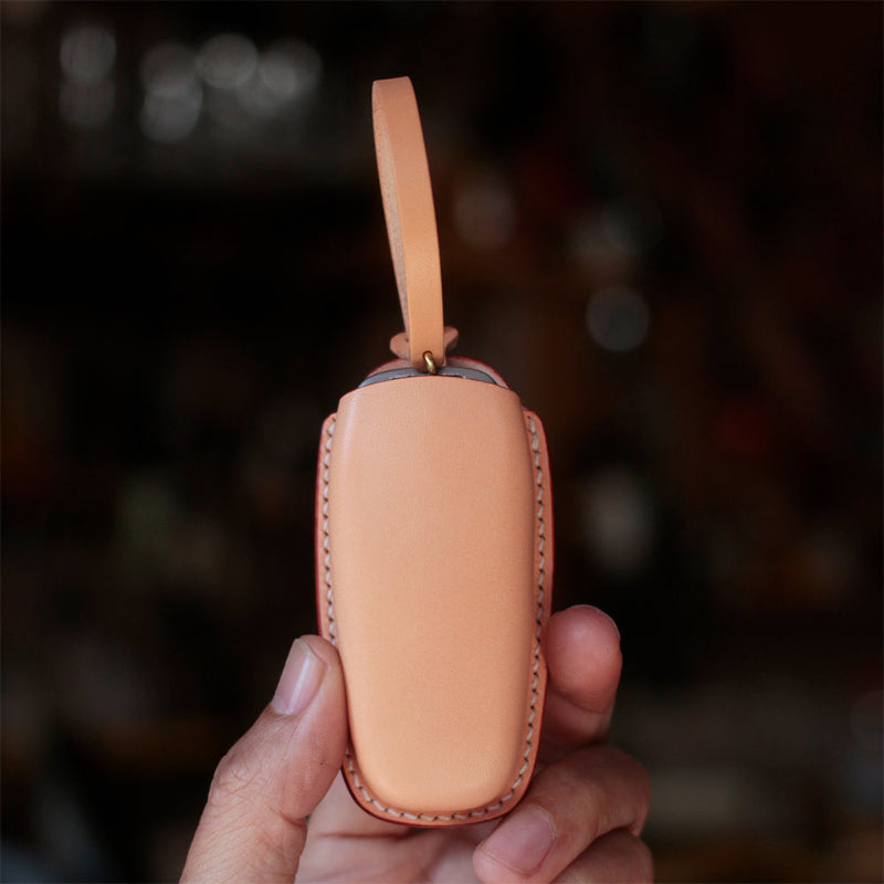 Sleek unibody leather key case with seamless button access for Audi

