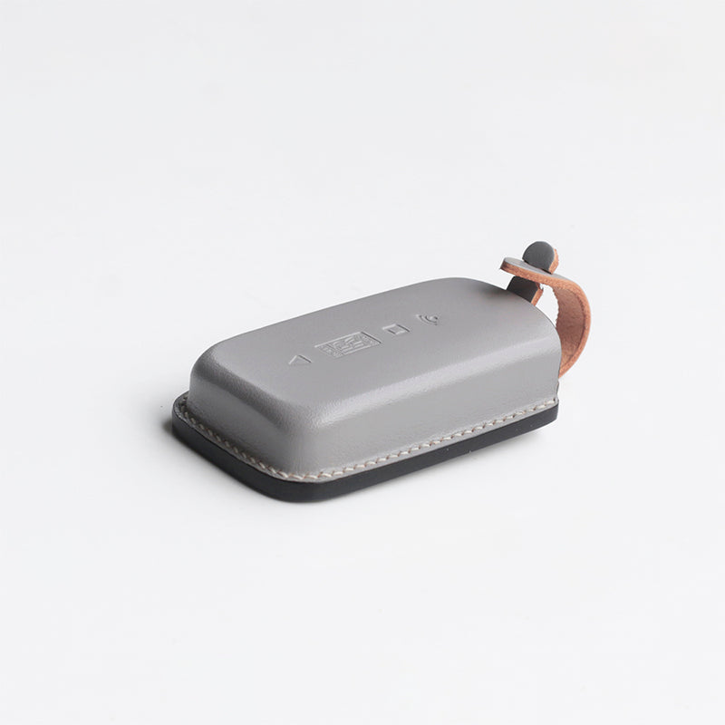 Close-up of Rolls-Royce premium vegetable-tanned leather key fob case – handcrafted for Phantom Ghost Cullinan

